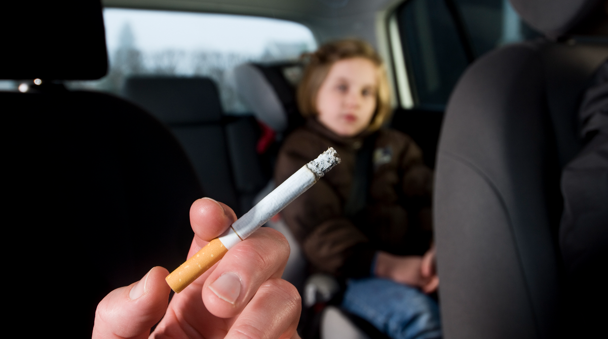 A lit cigarette inside a car