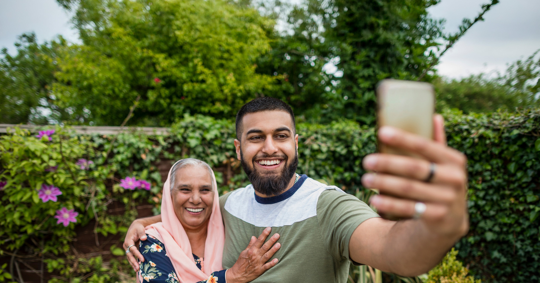 Couple taking selfie in a garden