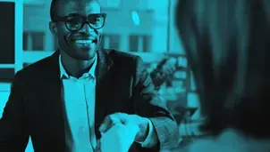 Man at work in the office wearing a suit jacket