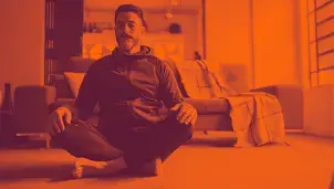 Man sitting cross legged on the floor