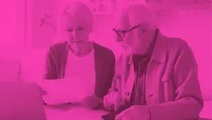 Two people looking at documents