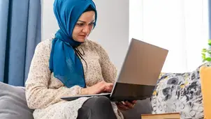 Woman looking at a laptop