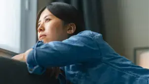 Woman looking out of a window