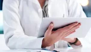 Researcher using a tablet