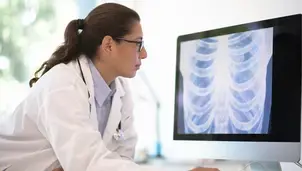 Researcher looking at chest x-ray