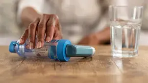 Inhaler and spacer on a table