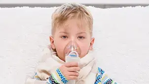 Child using a nebuliser