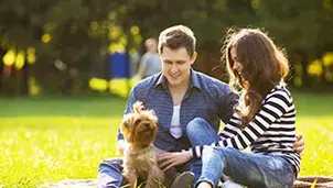 Couple with a dog in a park