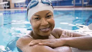 Smiling woman in swimming pool