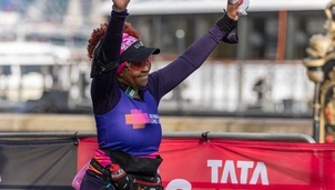 Runner with arms raised
