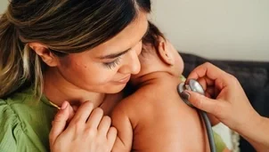 Baby being checked by a doctor