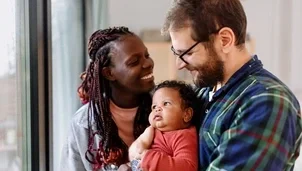 Parents holding their child