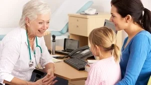 Parent and a child with a doctor