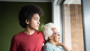 Two people looking out the window