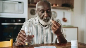 man taking a tablet 
