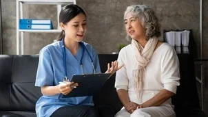 A woman talking to a healthcare professional