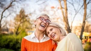 Two senior friends relaxing at the park