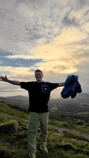 Smiling man opening his arms