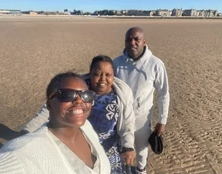 Selfie of three people at the beach