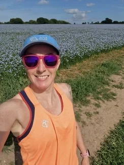 Selfie of a woman in a linseed field